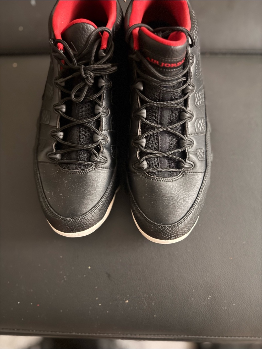 Jordan Black Sneakers with Red Collar Accent